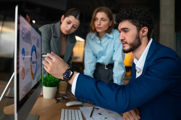 employee getting on job training from manager on how to use ERP