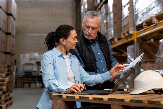 employees checking current stock and inventory levels on ERP automation software