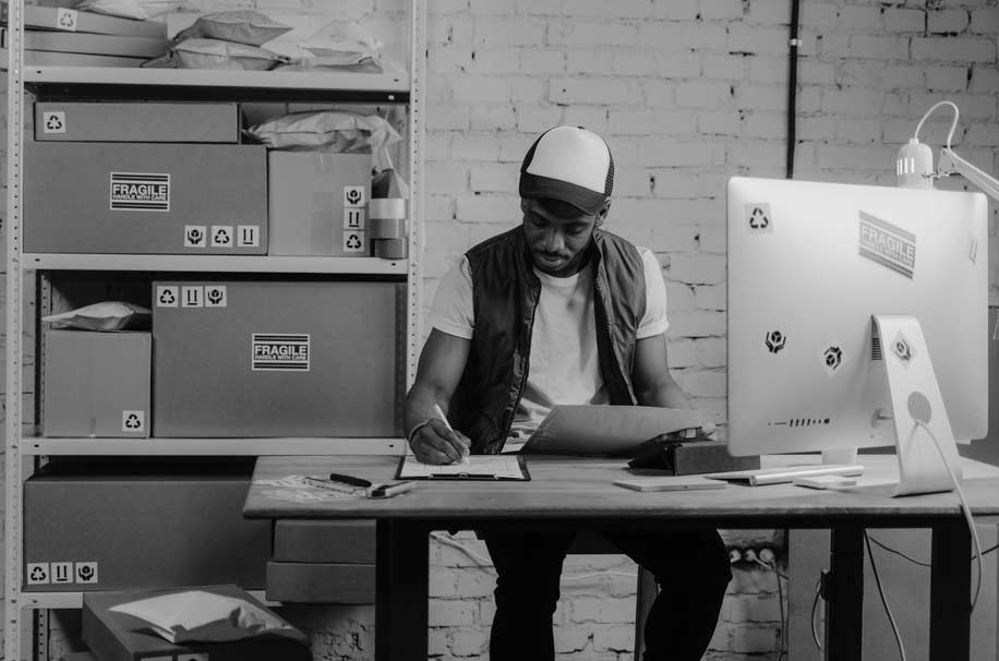 guy managing orders and financial data track on erp