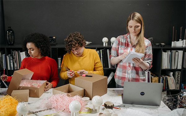 sales and packaging reps managing orders manually